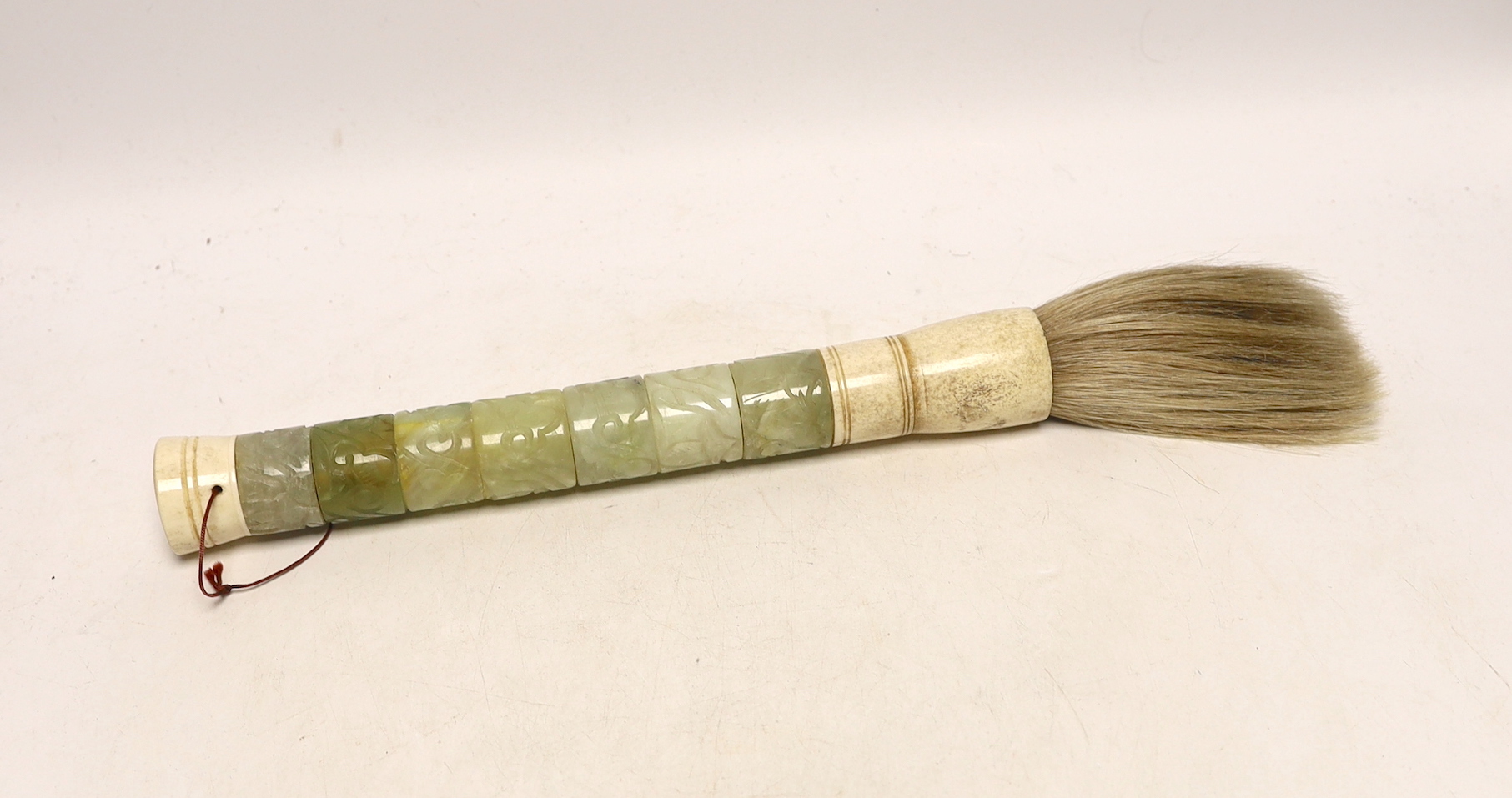 A mixed carved jadeite fly whisk, 39cm long